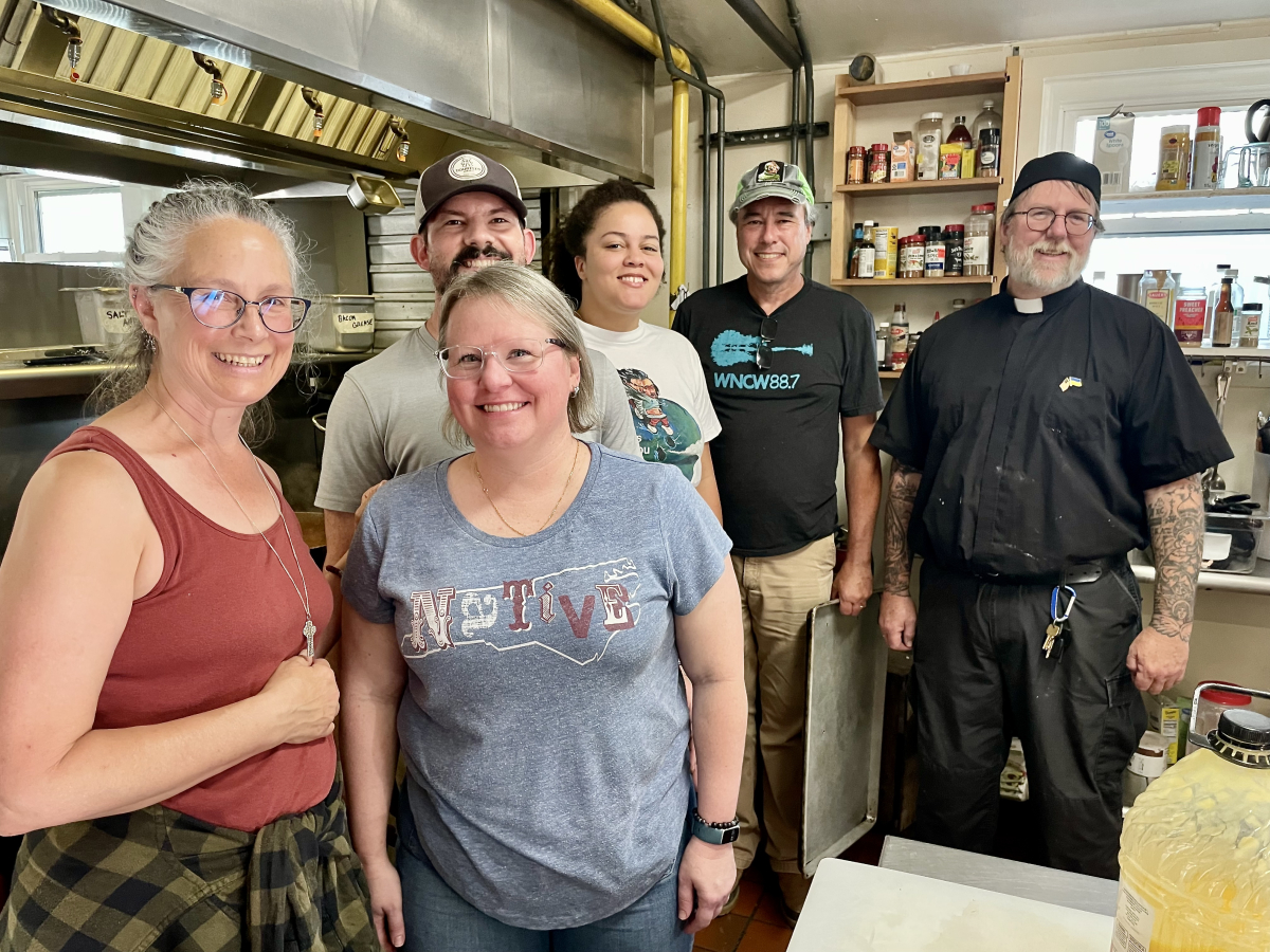 Volunteers (left to right) Sue Cummings, Katherine Ramey, Ed Bailey, Bri Myles, Andy Bailey and Bob Cummings, cooked and plated hot meals at Haywood Pathways Center on Oct. 5. 