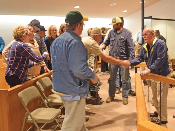 Cochran shakes hands with his supporters after the board of elections dismissed the candidate challenge against him. Jessi Stone photo