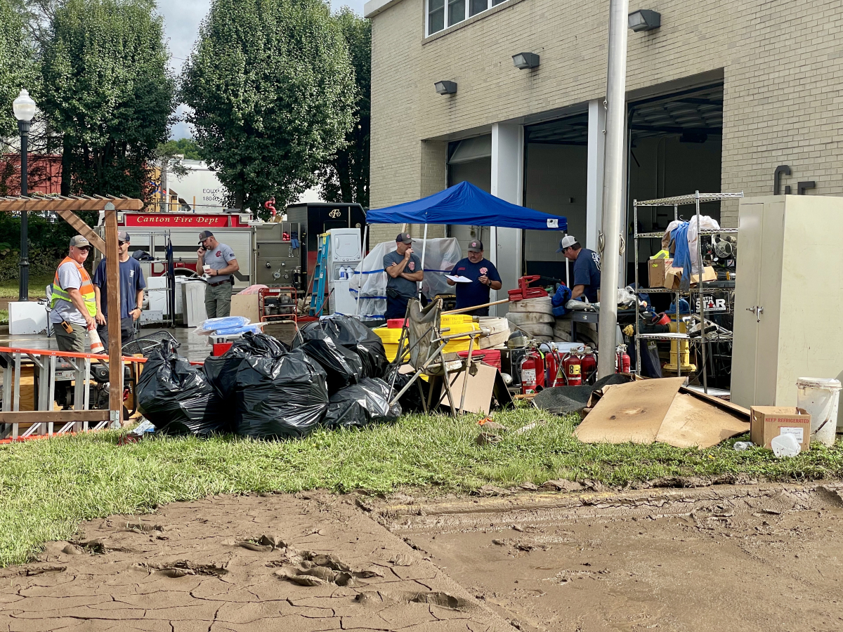 Canton firefighters continue to clean out supplies and equipment from their flood-ravaged station off Park Street on Aug. 20, 2021 — three days after floodwaters infiltrated the building. 