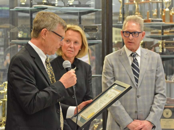 Dr. Anne Garrett (center) looks on as HCS Board Chair Chuck Francis (left) presents her with The Order of the Long Leaf Pine. Cory Vaillancourt photo                                              