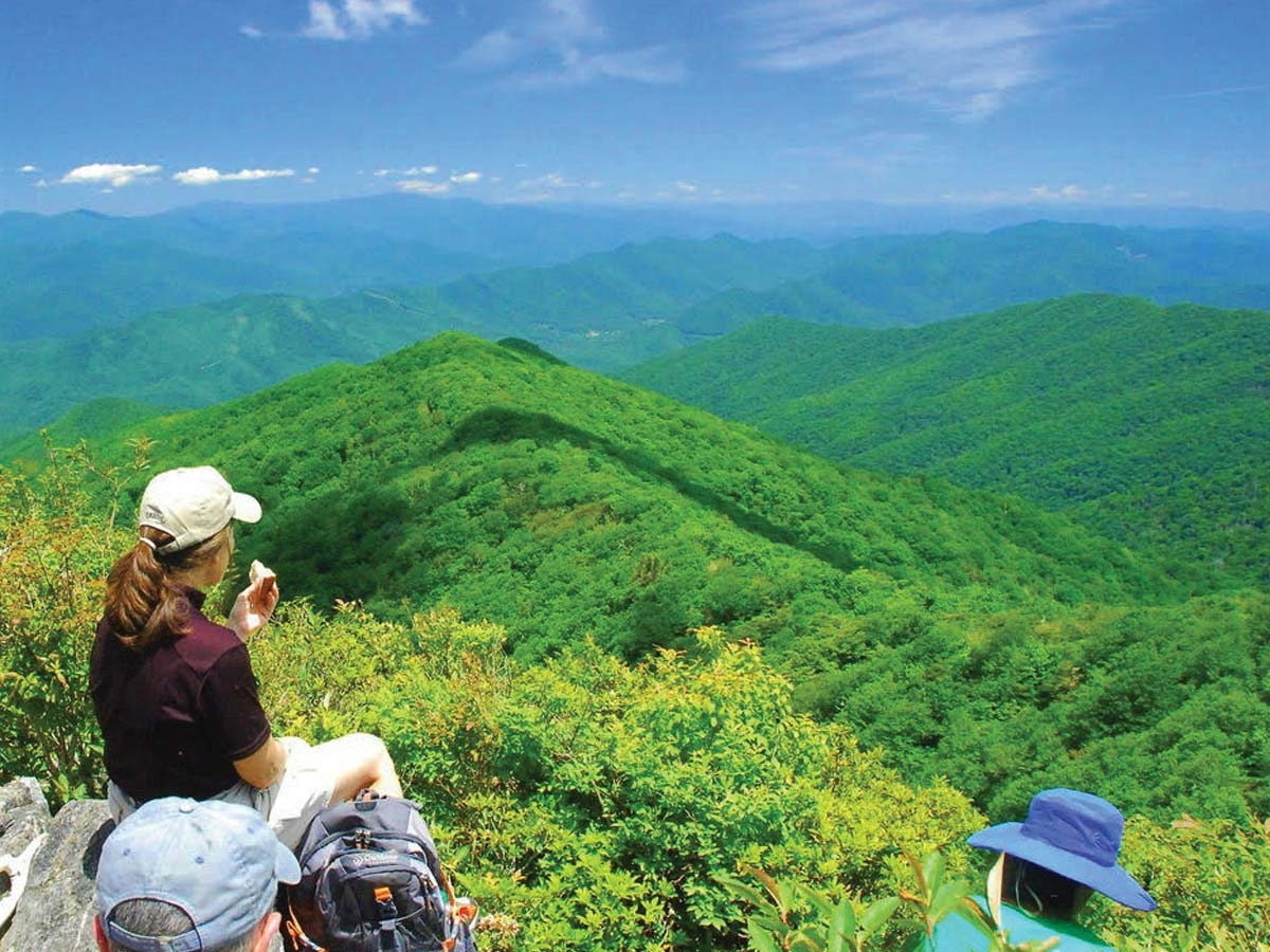 Sissie Rary enjoys a snack at The Hangover, a Benton MacKaye Trail overlook in Graham County. Suzy Downing photo