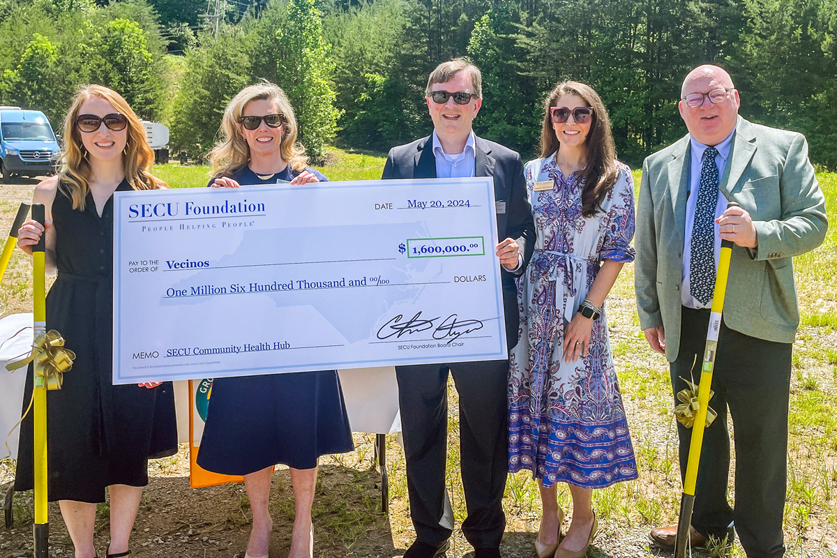 Vecinos CEO Marianne Rupp Martinez (left to right) with SECU Foundation representatives Jama Campbell, executive director, Chris Ayers, board chair, Parker Patterson, senior grants officer and Scott Southern, director of grants administration. Donated photo