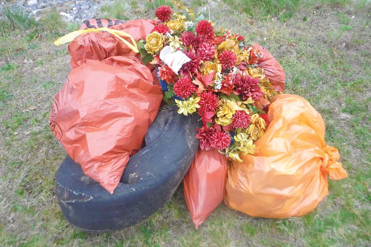 There were glass bottles, plastic drink containers, chip bags, foam cups, cigarette packs, grocery bags, a ripped-up Duke Power bill, a tire and a funeral wreath. Burt Kornegay photo