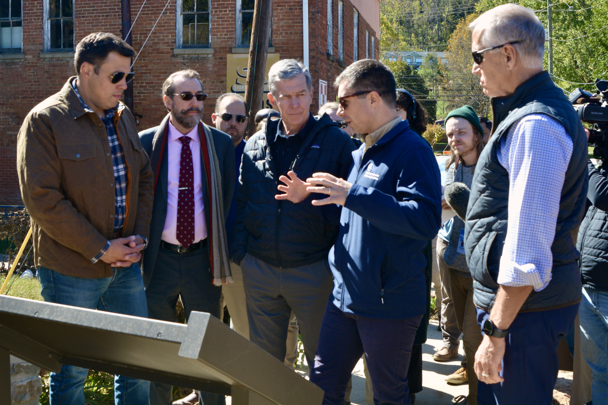 Sen. Thom Tillis (right) joins (from left) Canton Mayor Zeb Smathers, Waynesville Town Council Member Anthony Sutton, Gov. Roy Cooper and Transportation Secretary Pete Buttigieg in Canton Oct. 17. 