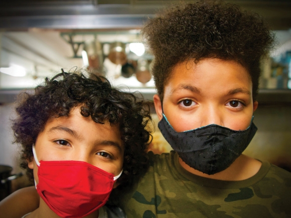 Faylen (left) and Liam Kelly helped prepare dinner at Pathways on Aug. 7. Cory Vaillancourt photo