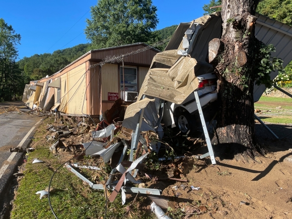 Damage to vehicles and dwellings is widespread near the Cruso Community Center this morning following the massive floodwaters last night. 