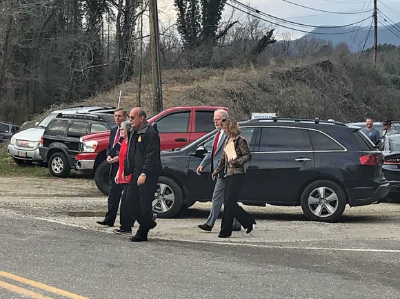 Swain County Sheriff Curtis Cochran and his supporters make their way into a packed Board of Elections Office for a preliminary hearing on the candidate challenge. Jessi Stone photo