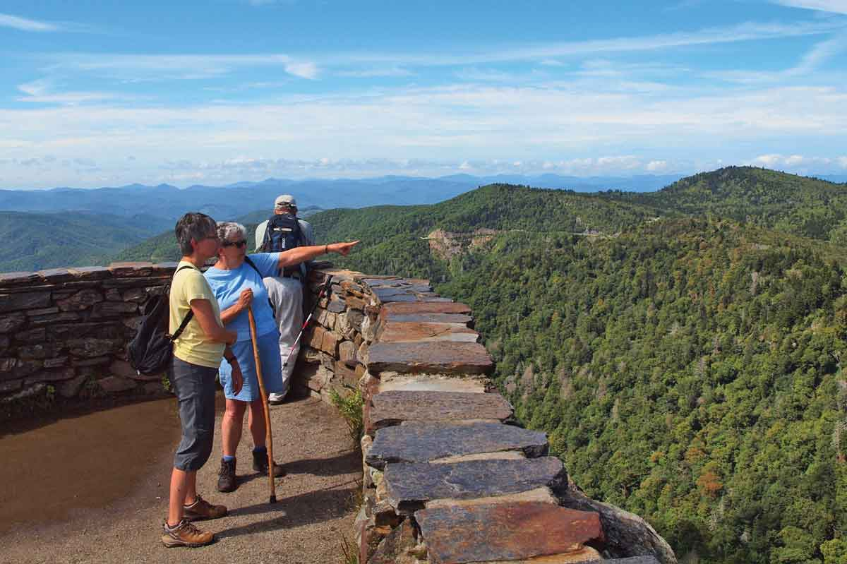 Blue Ridge Parkway visitors enjoy one of the park’s countless sweeping views. File photo 