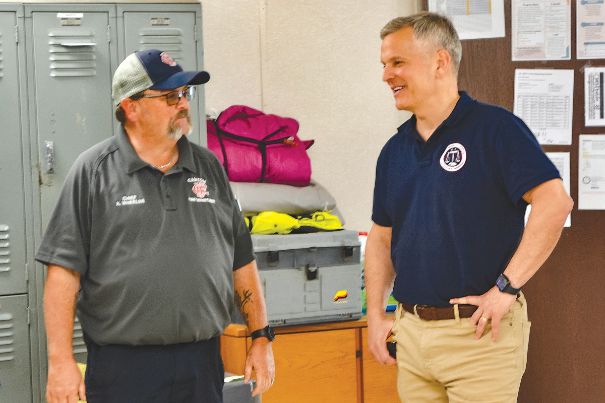 Attorney General Josh Stein (right) talks with Canton Fire Chief Kevin Wheeler at Canton’s town hall complex on Oct. 7. Cory Vaillancourt photo