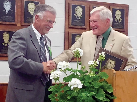 Ted Carr (right), past president and board chair of Bethel Rural Community Organization, inducts Bill Holbrook into the 2018 Western North Carolina Agricultural Hall of Fame. Donated photo