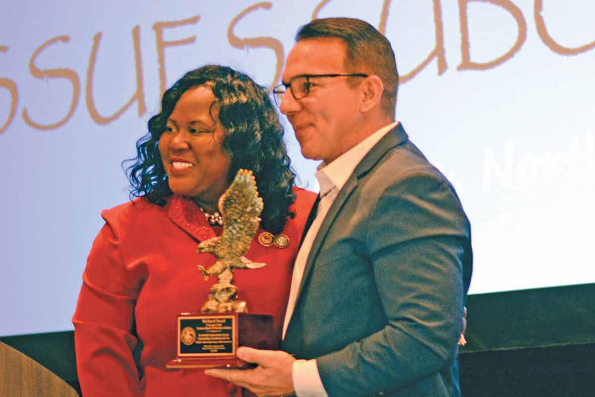 U.S. Attorney Dena King presents Principal Chief Richard Sneed an award in recognition of his efforts to partner with and support the Western District Court of North Carolina. Holly Kays photo 