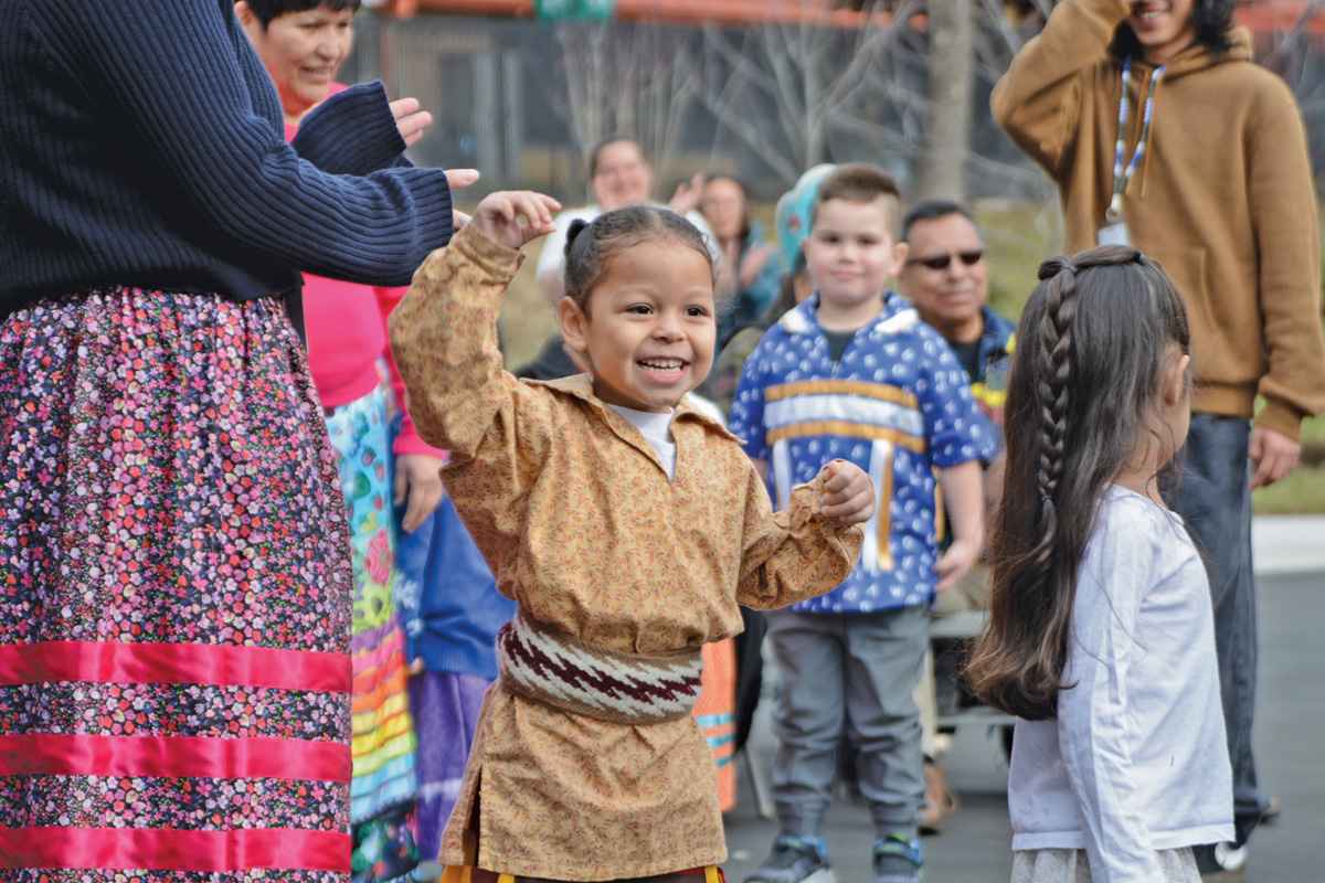 A New Kituwah Academy student helps celebrate the event by participating in a traditional dance. Holly Kays photo