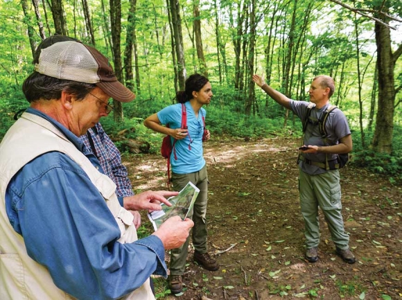 Smith (far right) leads a tour of a Mainspring property in Graham County. Mainspring photo