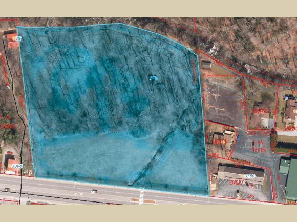 A 5.9-acre parcel on Soco Road in Maggie Valley (in blue) may soon be home to a national chain hotel. Haywood GIS photo