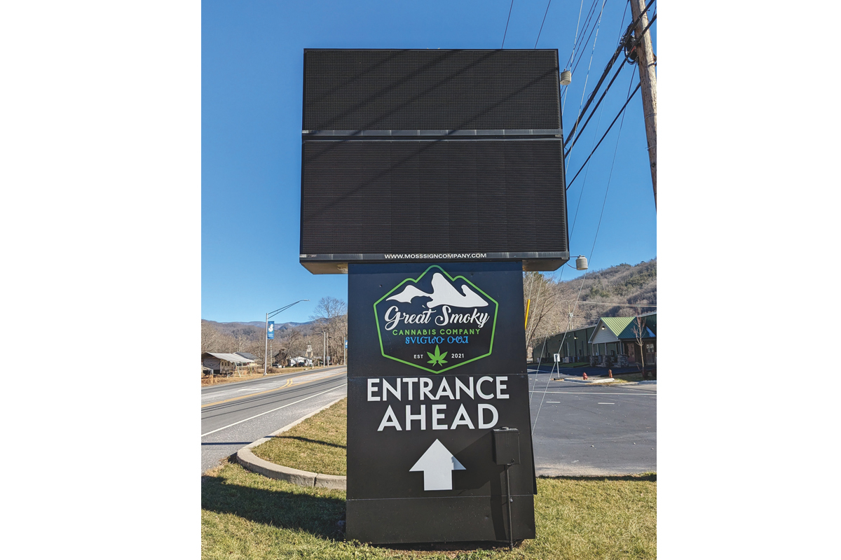 A sign along U.S. 19 points the way to Cherokee’s cannabis dispensary, but the shop has not yet announced an opening date. Holly Kays photo