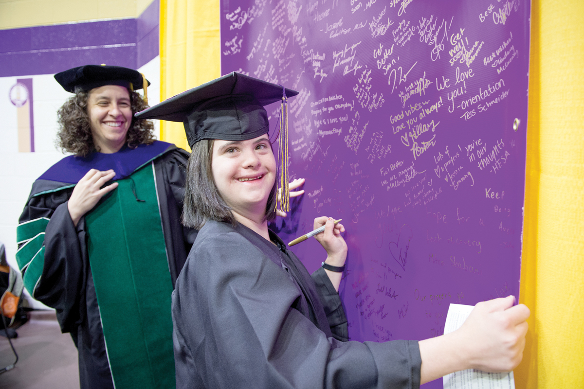 Program Director Kelly Kelley (left) celebrates with a  University Participant Program student following  the spring 2016 commencement. WCU photo