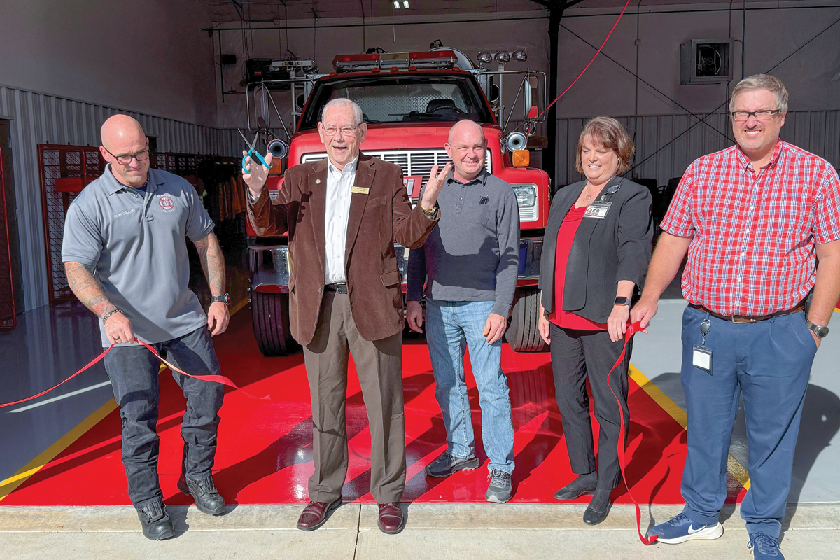 Town staff and elected officials celebrate the ribbon cutting. 