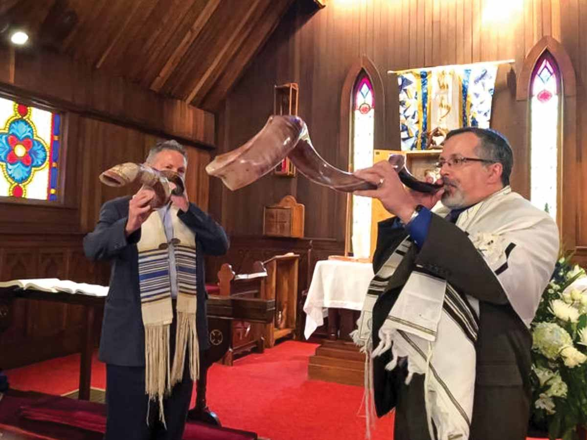 Synagogue leaders sound the shofar during service. Mountain Synagogue photo