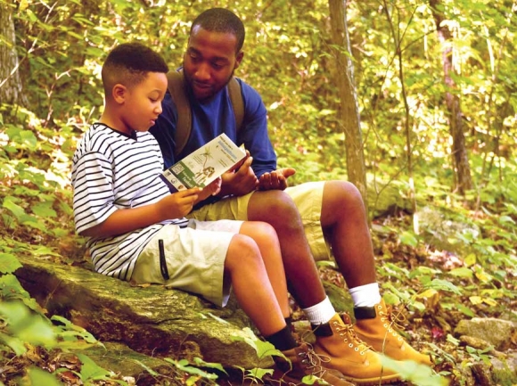 A father and son examine their progress at Chimney Rock State Park. Donated photo