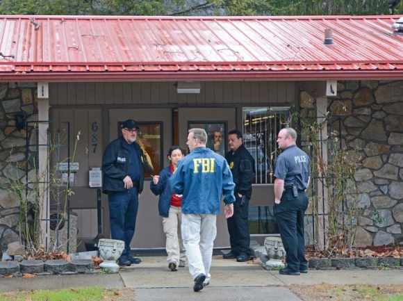 FBI agents raid the Qualla Housing Authority in February 2017. Holly Kays photo 