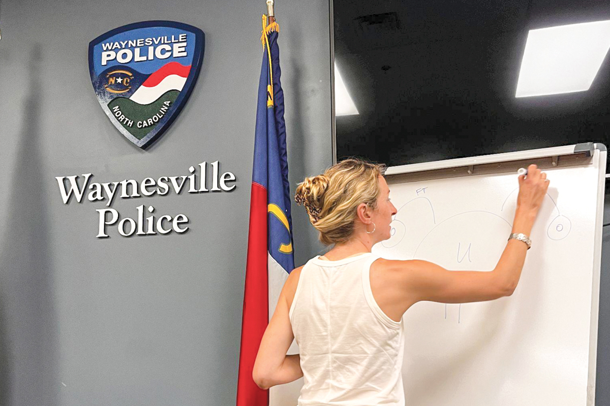 Katie Miller teaching community advocates about forensic evaluations. 