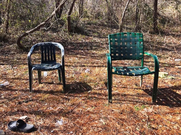 A pair of chairs sits empty in a small homeless encampment in Haywood County. Cory Vaillancourt photo