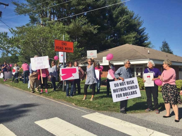Franklin residents protest last spring after Mission Health announced it would be closing labor and delivery at Angel Medical Center. Residents are now worried about the impact HCA’s purchase of Mission will have on their community hospital. File photo