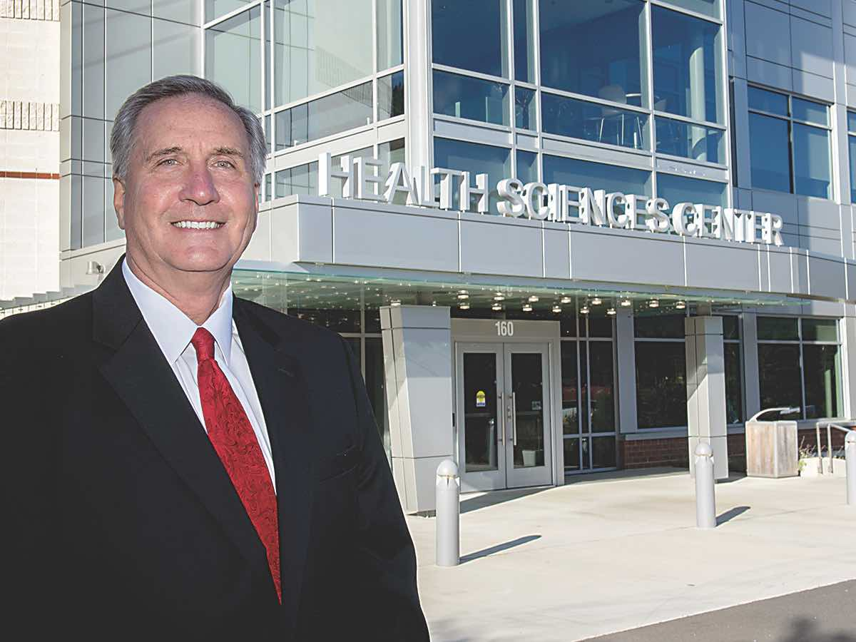 Dr. Don Tomas is starting his 11th year as Southwestern Community College’s President. He’s shown here in front of the Don Tomas Health Sciences Center.