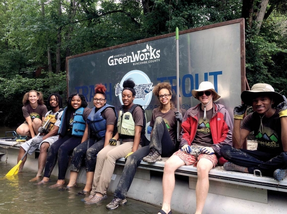 Volunteers pose with the litter-catching Trash Trout. Asheville GreenWorks photo