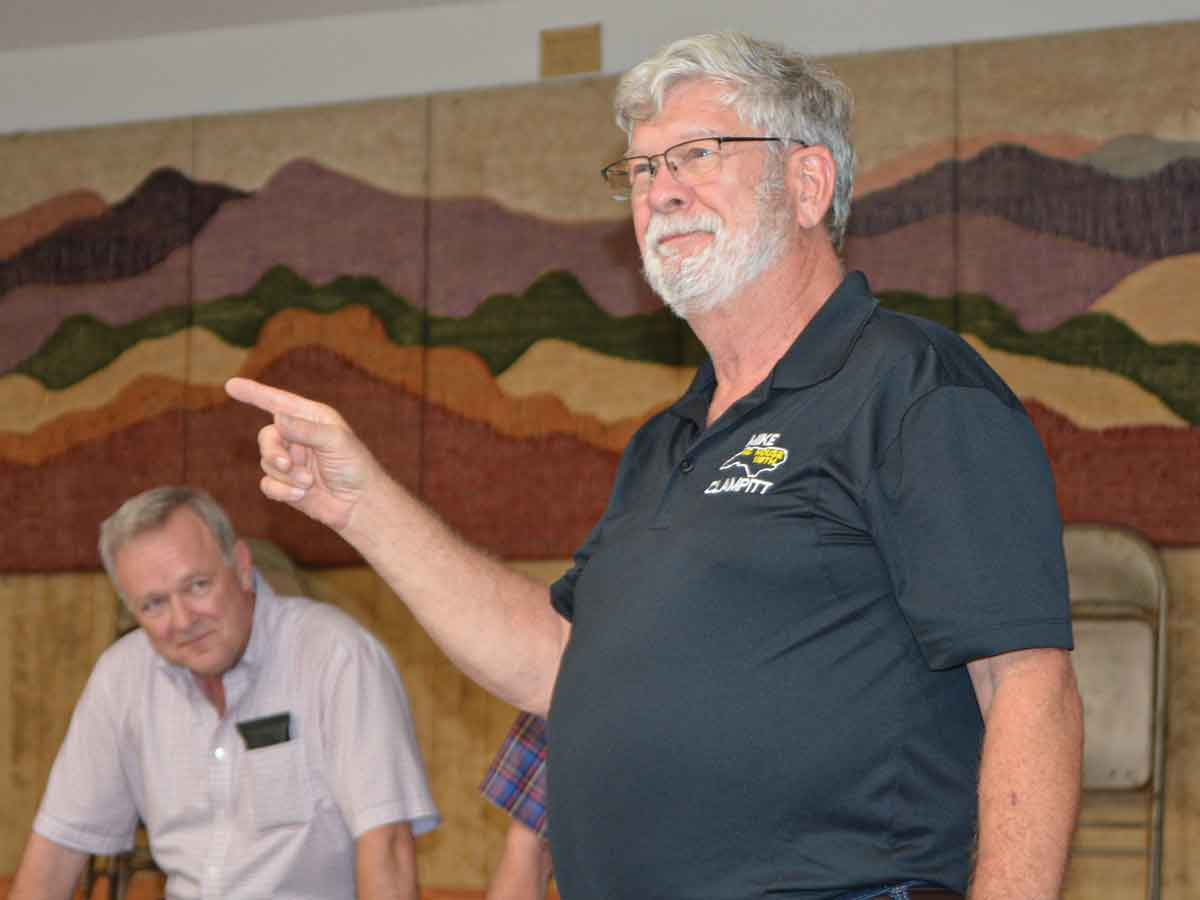 Rep. Mike Clampitt speaks to a crowd at a recent rally in Maggie Valley. 