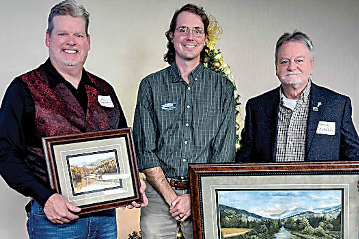 Partner of the Year winner Kevin Sandefur of BearWaters Brewery (from left) stands with Haywood Waterways Executive Director Preston Jacobsen and Pigeon River Award winner Mayor Gary Caldwell, representing the Town of Waynesville. HWA photo