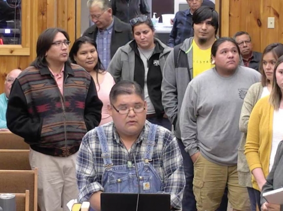 Surrounded by his fellow Cherokee language learners, Matt Tooni addresses Tribal Council regarding the group’s request for $15 million in funding to support language preservation programs. ECBI image