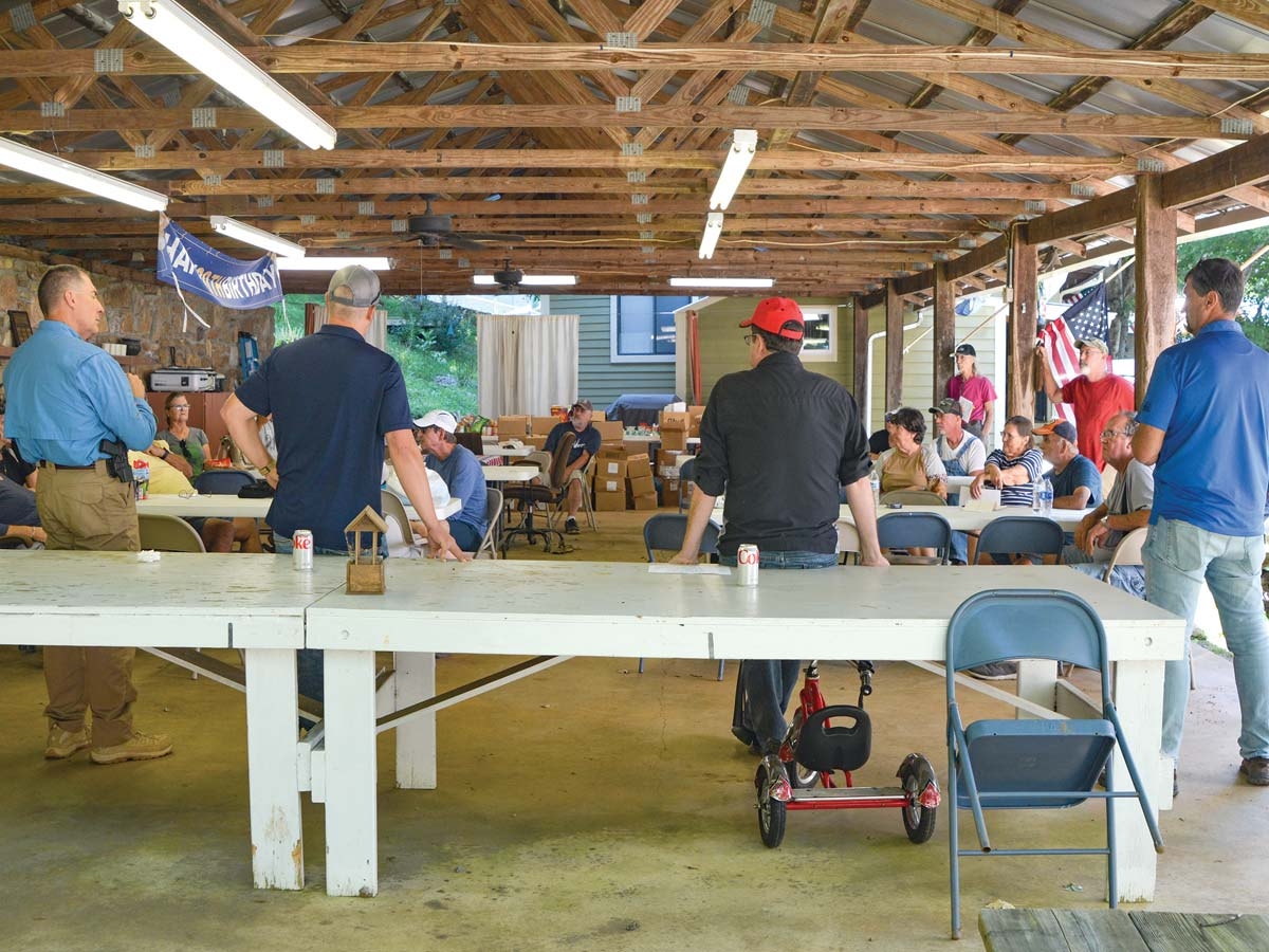 Local officials including (left to right) Sheriff Greg Christopher, Commissioner Brandon Rogers, Sen. Kevin Corbin and Rep. Mark Pless talk to residents of Laurel Bank Campground on Sept. 2. Cory Vaillancourt photo