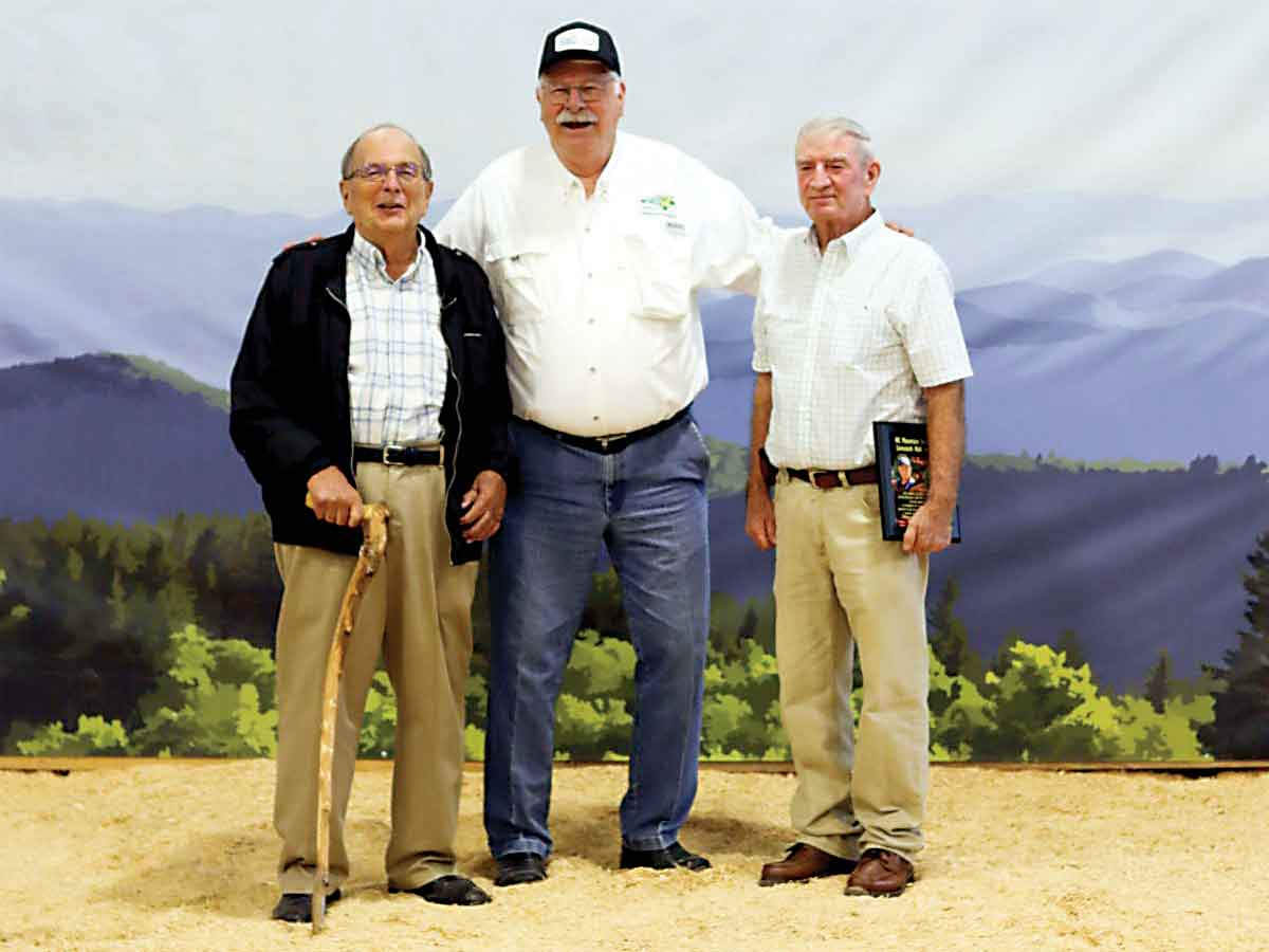 Inductees Jerry Plemmons and Jerry Roberts stand with Agriculture Commissioner Steve Troxler. Donated photo