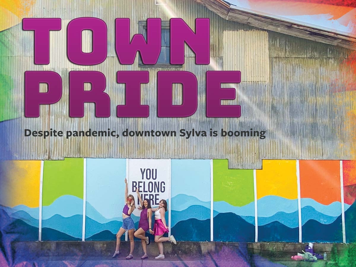 WCU students Kinley Cook, Laila Figaroa and Megan Gorman stand in front of Sylva’s new mural by Worth LaRose. Hannah McLeod photo