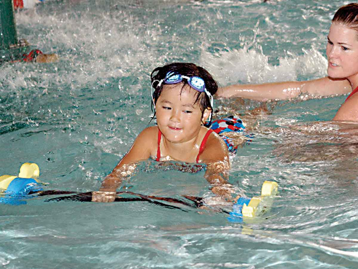 A young swimmer learns her strokes. File photo 