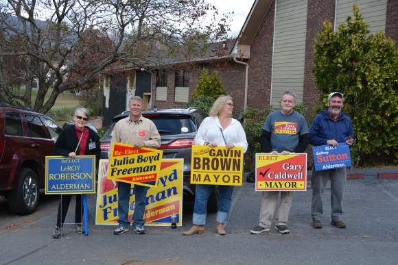 Alderman Gary Caldwell (second from right) and Kimberly Brown Czaja (center) campaign at the Pigeon Street poll. 