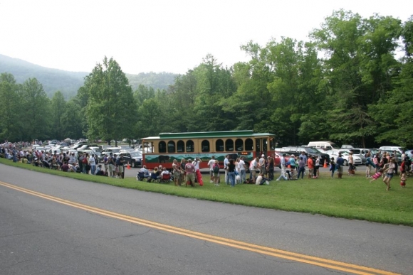 Visitors wait for the trolly to Elkmont Campground to view the synchronous fireflies during a prior year. NPS photo