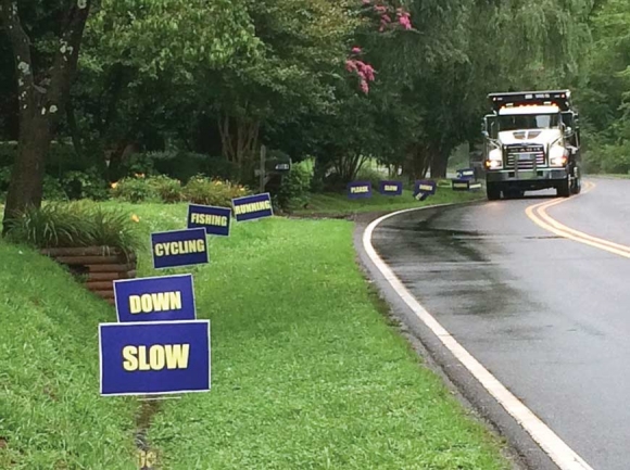 Newly posted signs ask drivers to slow down while driving South River Road. Donated photo