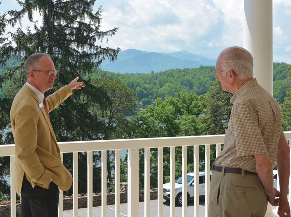 Lake Junaluska Executive Director Ken Howle (left) chats with Lake resident Bill Lowry on the second floor balcony at the Lambuth Inn. Cory Vaillancourt photo