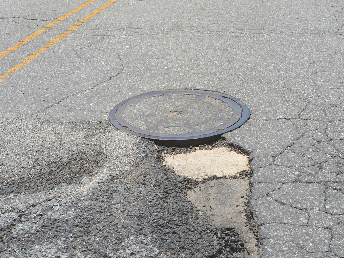 The proposed vehicle fee would help fill potholes, like this one photographed on Holtzclaw road in 2018. Cory Vaillancourt photo
