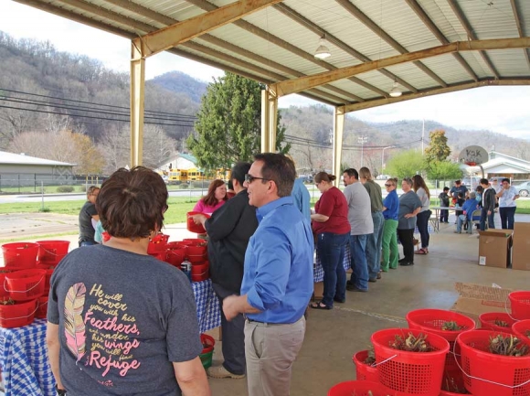 Tribal members choose their starts and seeds during the Community Garden Kit Giveaway. The kits include a variety of traditional and heirloom seeds. Donated photo