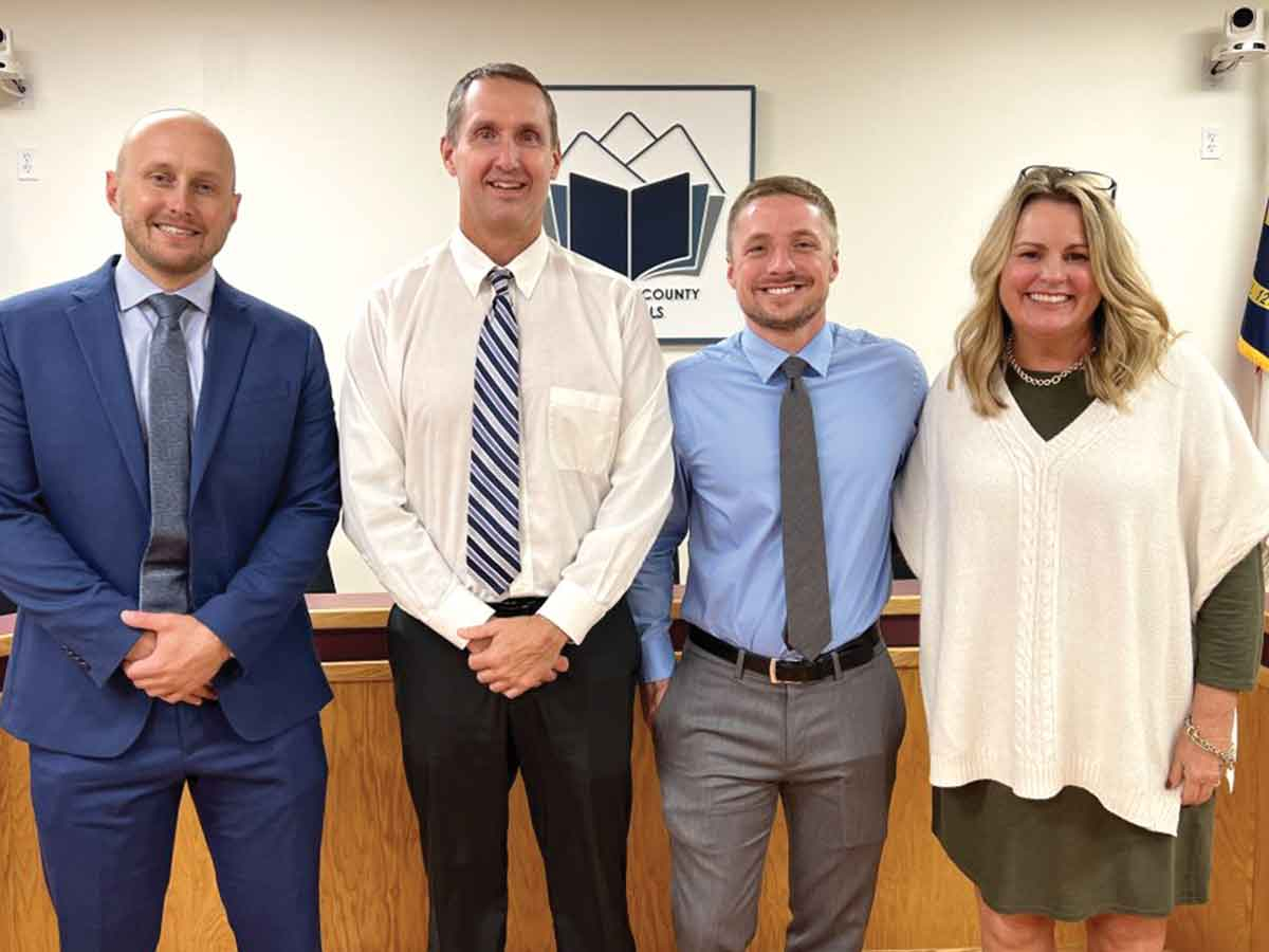 Casey Conard (from left), Trevor Putnam, Graham Haynes and Jill Barker pose at the Oct. 10 school board meeting. HCS photo