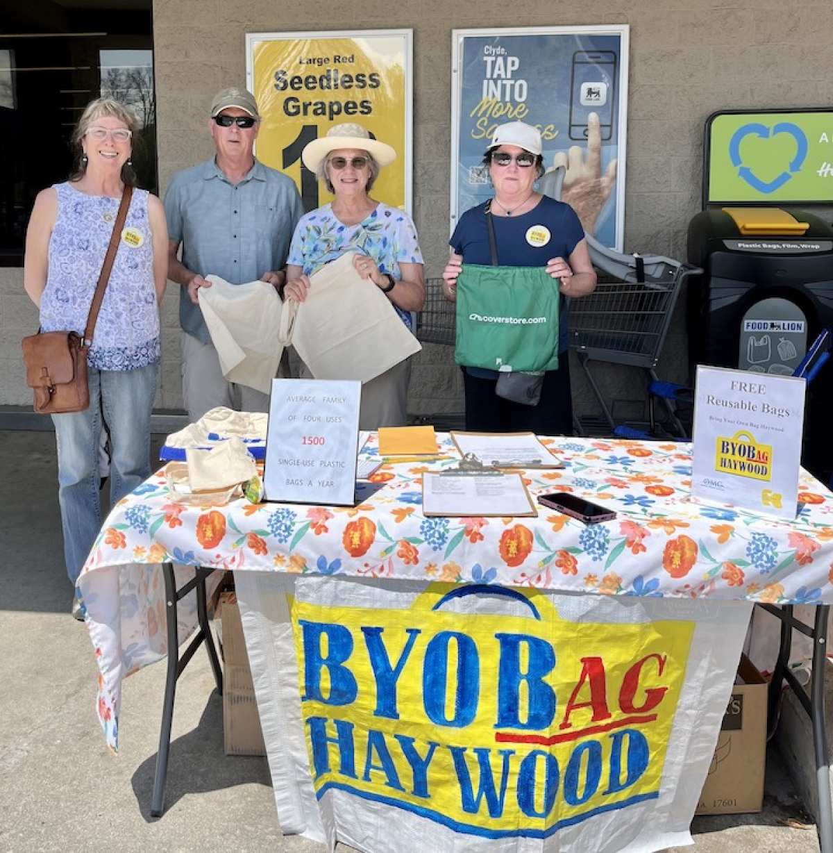 Volunteers give out reusable bags at Food Lion in Clyde on Friday, April 22. Pictured (from left) are Joan Doyle, Bill Hollowell, Penny Tracy and Pat Robbins. Donated photo