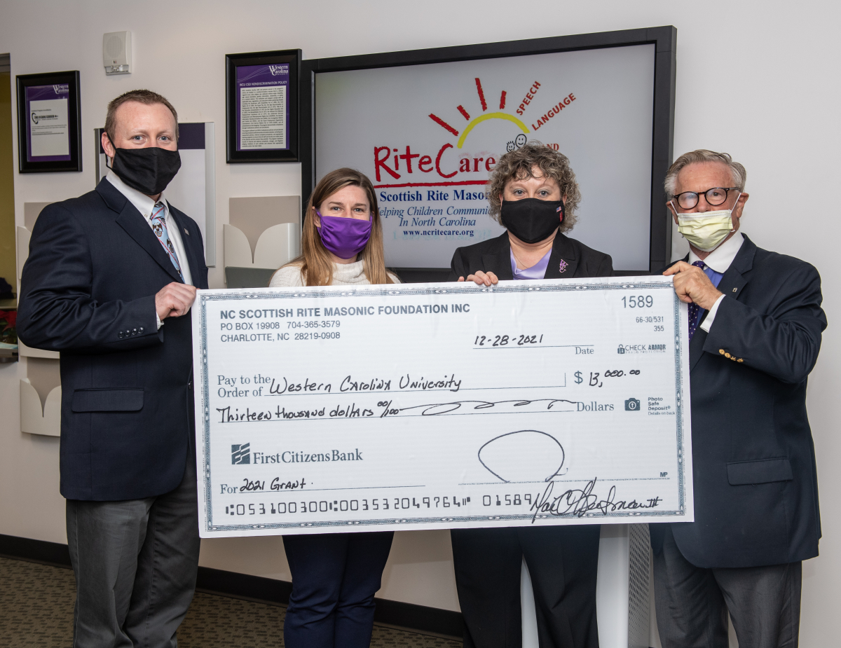 Members of the N.C. Scottish Rite Masonic Foundation present a $13,000 grant to representatives of the Speech and Hearing Clinic at Western Carolina University. From left are Andrew Norton, a 2002 graduate of WCU, Valley of Franklin representative for N.C. RiteCare; Traci Rice, a 1997 graduate of WCU and chair of the Department of Communication Sciences and Disorders; Lori Anderson, dean of the College of Health and Human Sciences; and Dan Killian, head of the Valley of Franklin chapter of N.C. RiteCare.