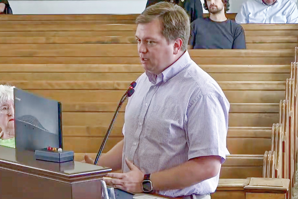 Haywood County Recovery and Resilience officer Cody Grasty speaks to Haywood County commissioners on Aug. 18. 