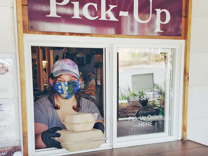 An employee at City Lights Café serves up an order from the restaurant’s new pickup window. Jackson County TDA photo