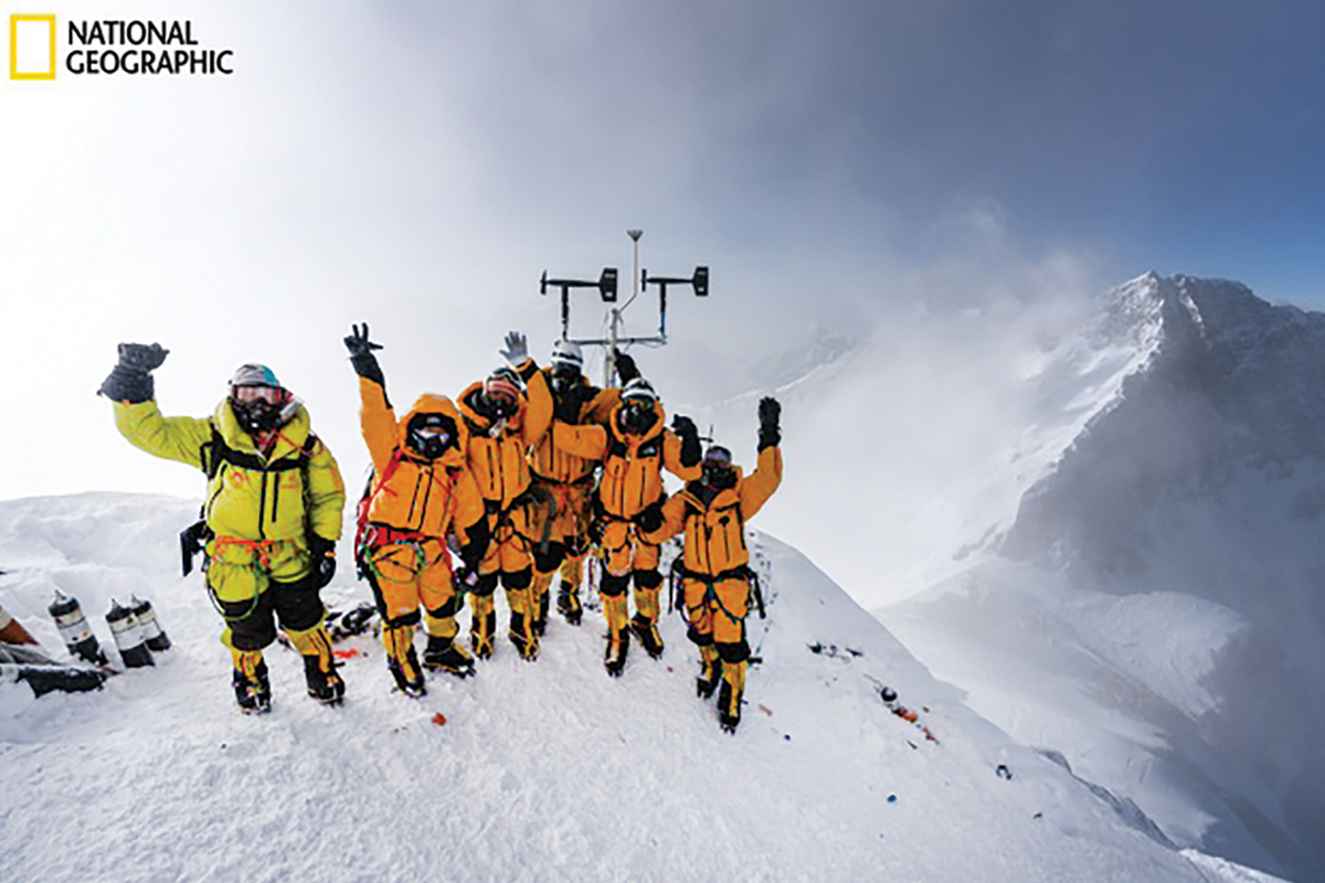 Baker Perry’s team waves from Mount Everest. National Geographic photo 