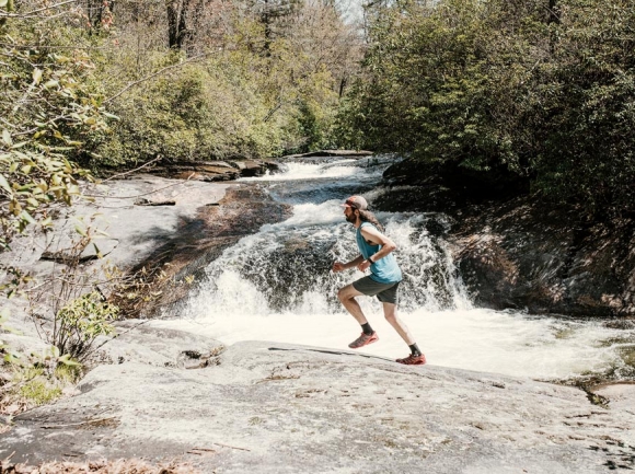 Brendon Voelker stretches his legs on a run in Panthertown. L.J. Gay photo