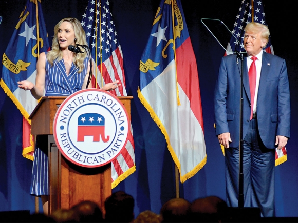 Lara Trump (left) stands with her father-in-law on June 5, 2021 in Greenville, NC.  